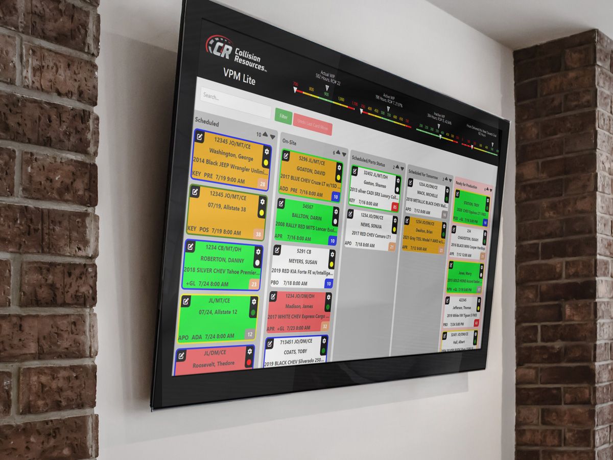 visual production manager showing collision center production schedule on a TV